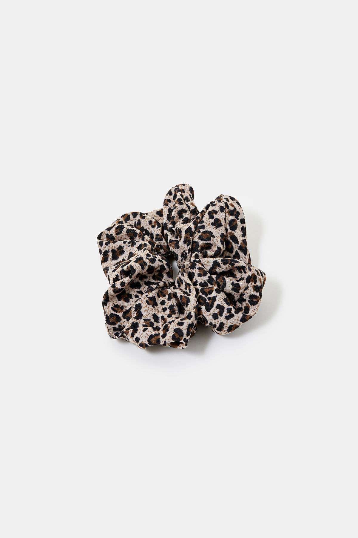 Brown leopard-print fabric scrunchie, ruched texture and knot look