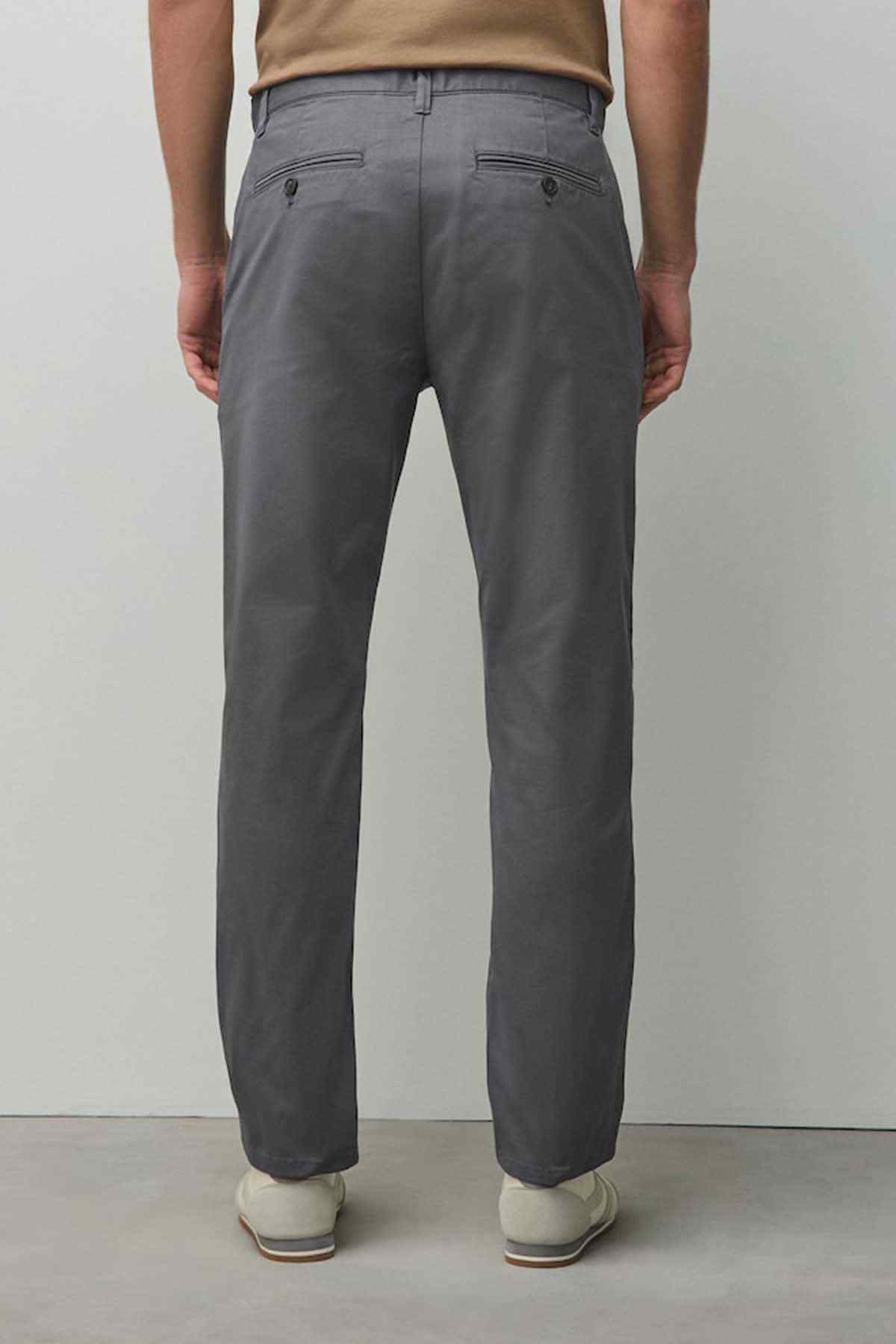 Dark grey chino trousers full view with belt loops and button fly