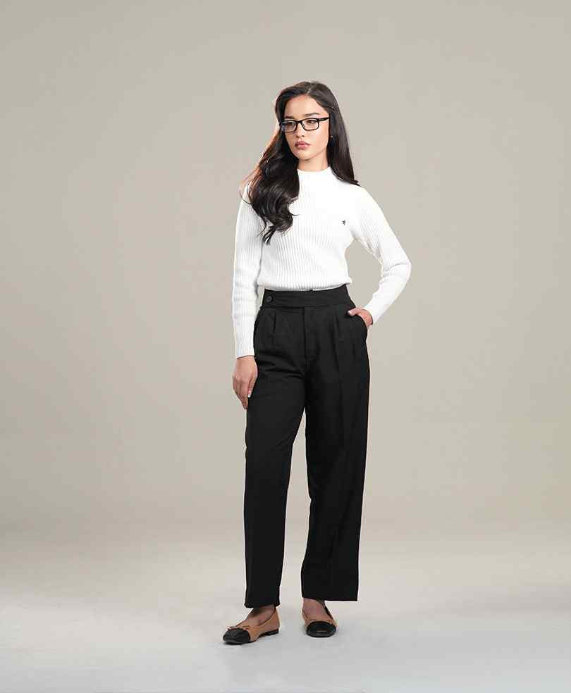 White fitted ribbed knit sweater with long sleeves and small chest logo, full-length view
