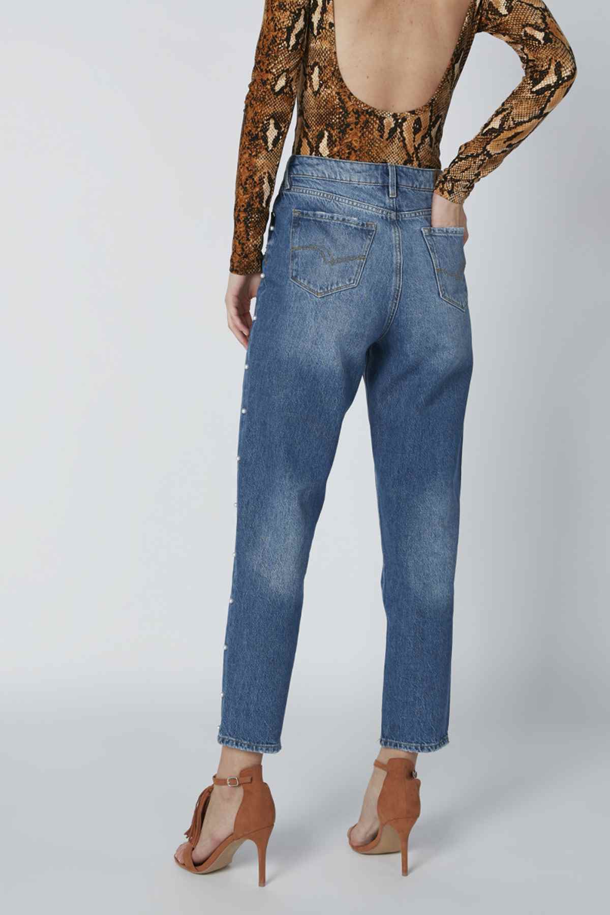 Blue distressed denim jeans with front pockets and ankle-length cuff