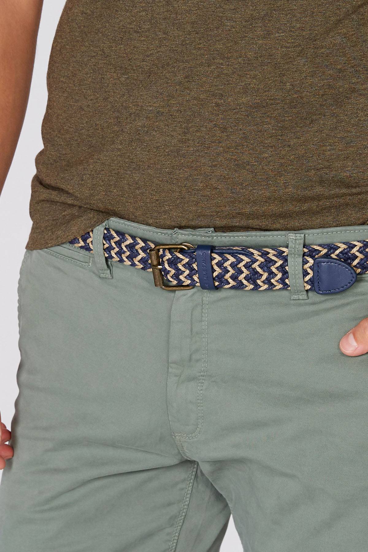 Green chino pants with woven belt and blue-brown metal buckle