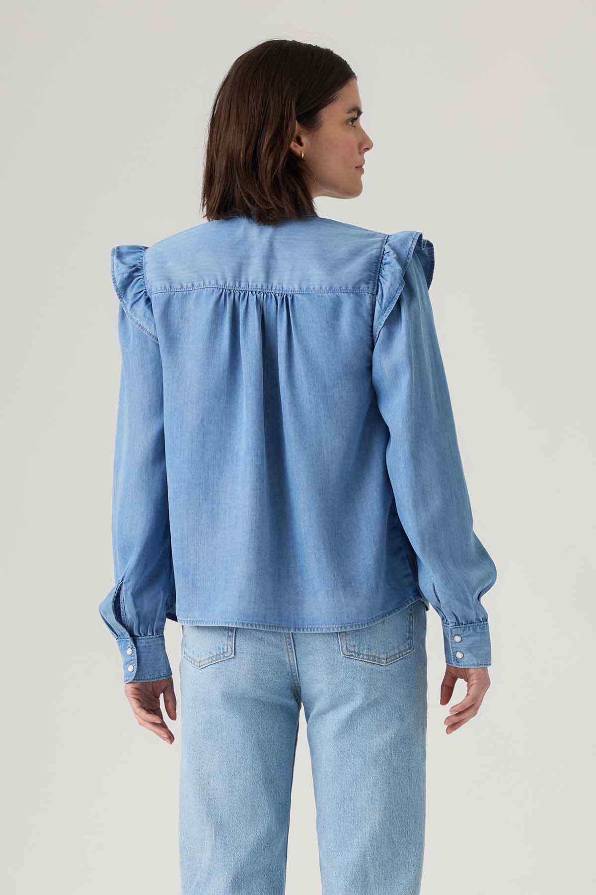 Levi's light blue denim blouse back view with ruffled shoulder design