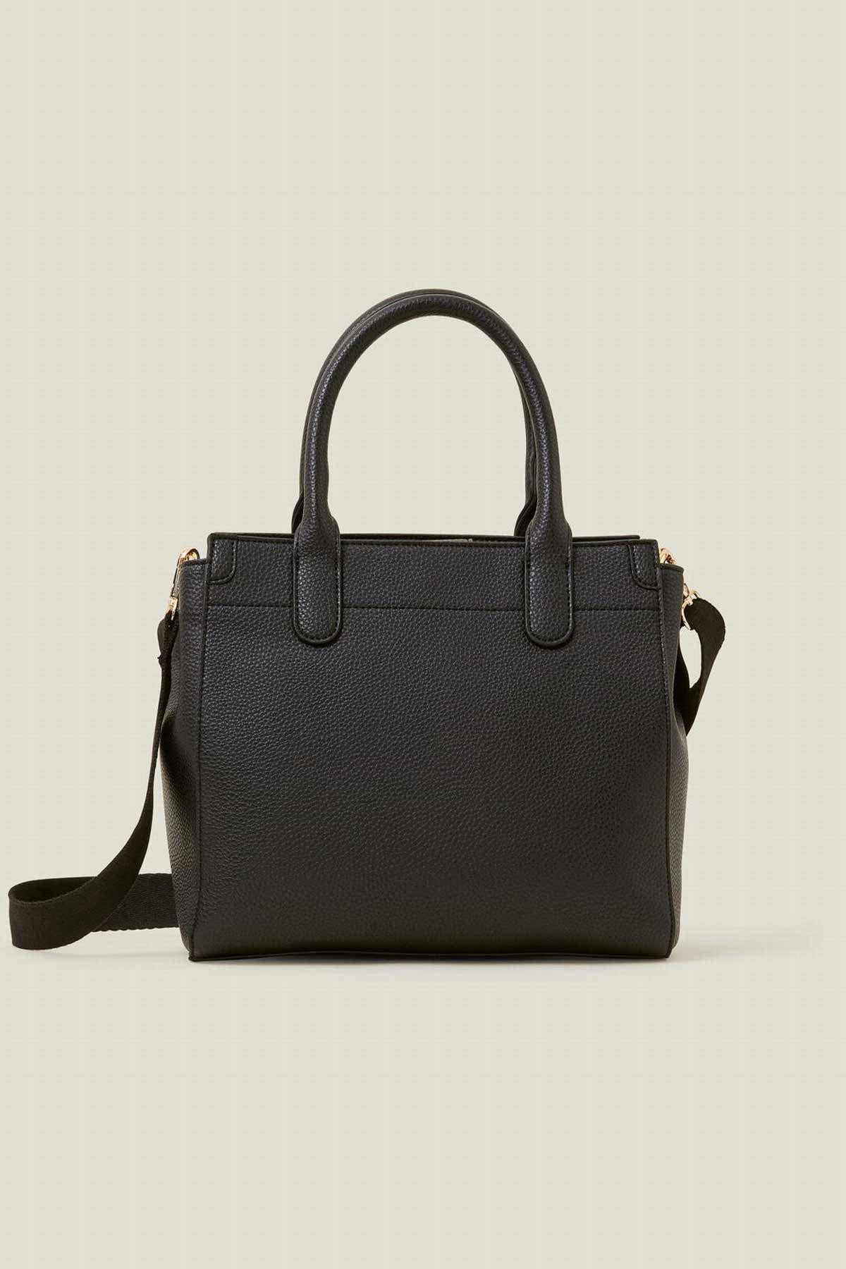Black structured handbag with top handles and shoulder strap