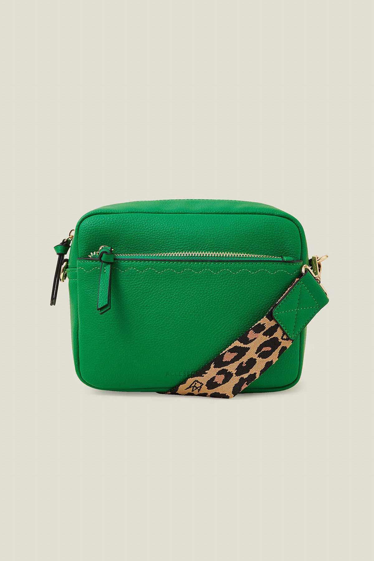 Green crossbody bag with top zip and leopard print strap