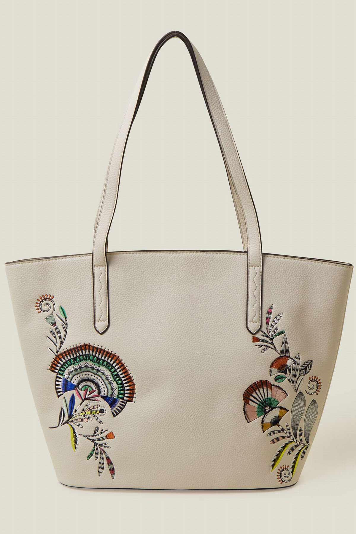 Cream canvas tote bag with embroidered bird and floral patch, two handles
