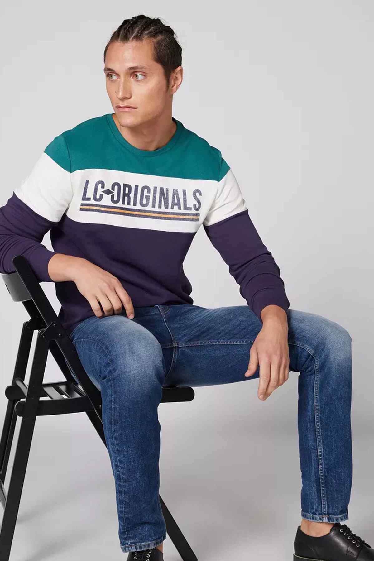 Colorblock crewneck sweatshirt in teal, white, and purple with long sleeves