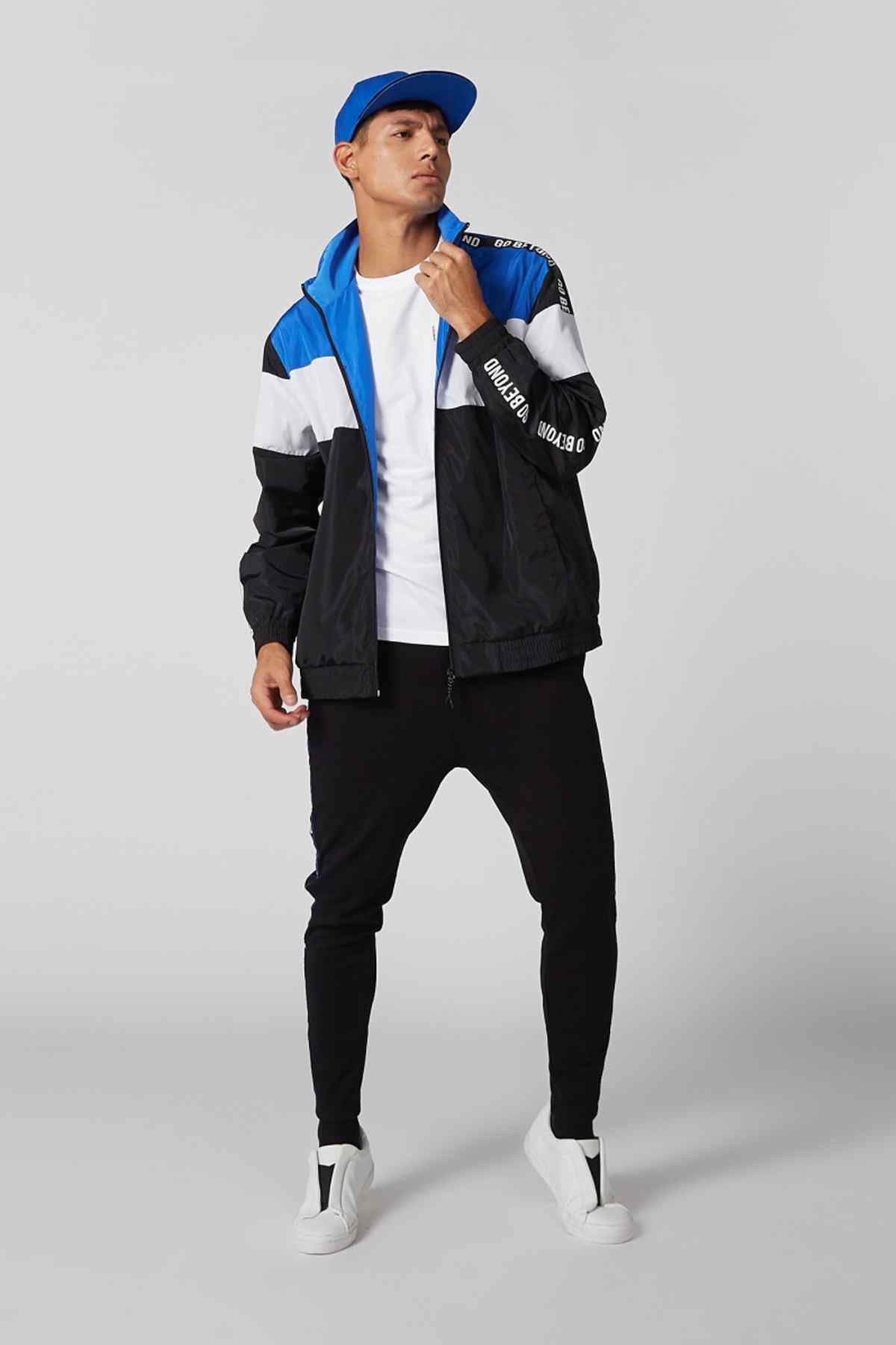 Colorblock Splash windbreaker jacket, blue and black with white panels, front zip.