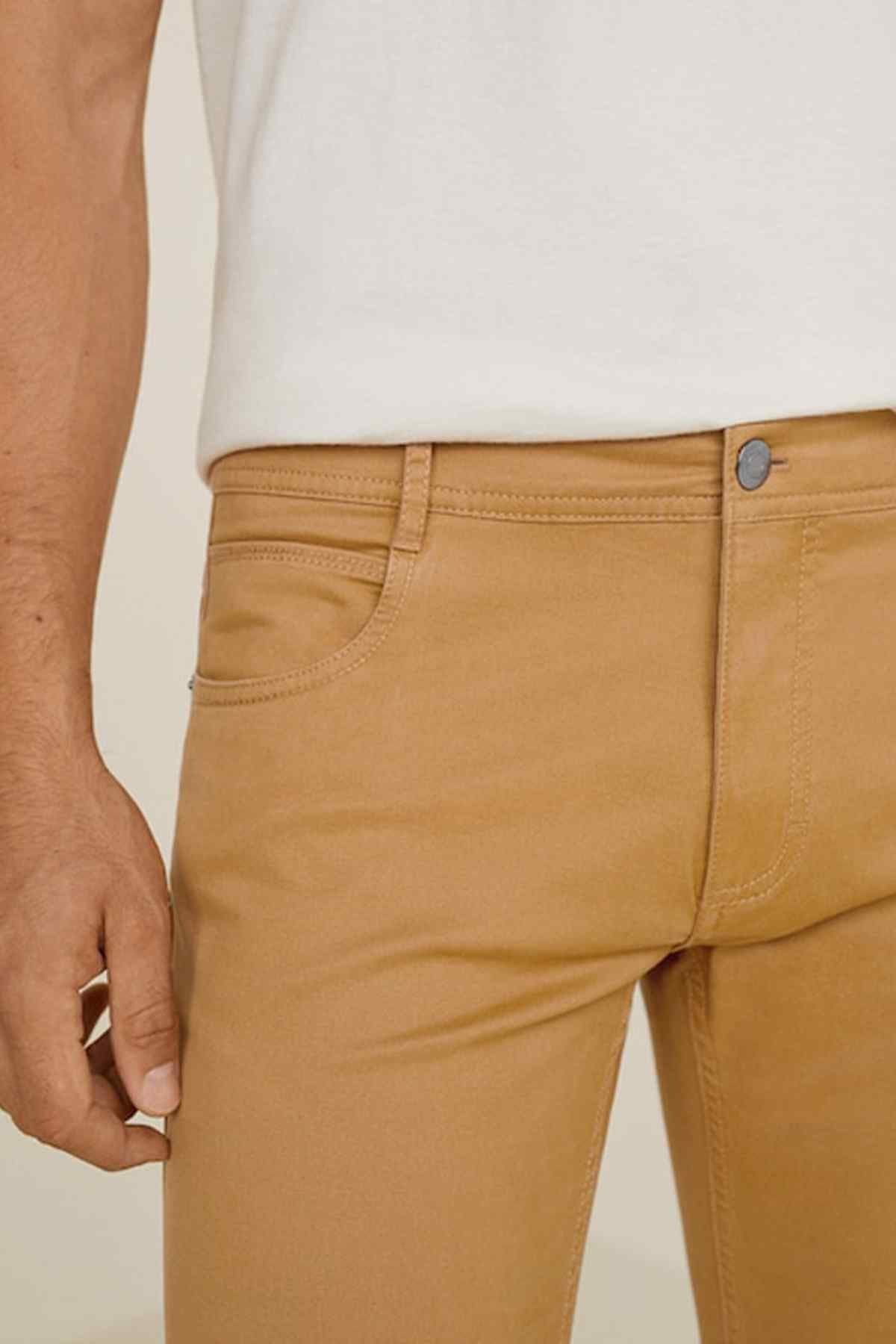 Tobacco brown chino pants close-up: waistband, belt loops, and front button