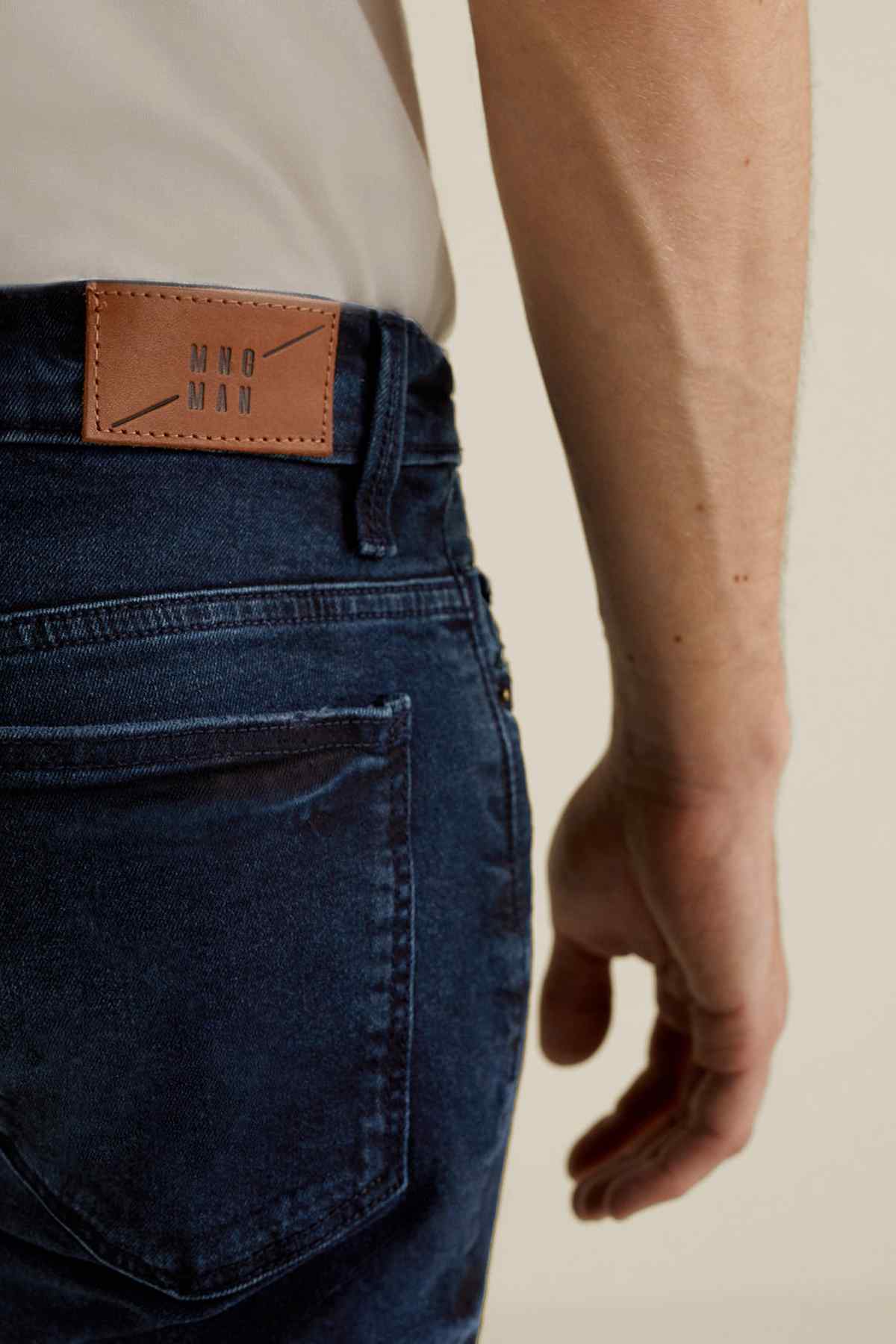 MANGO dark blue denim jeans with leather brand patch on waistband