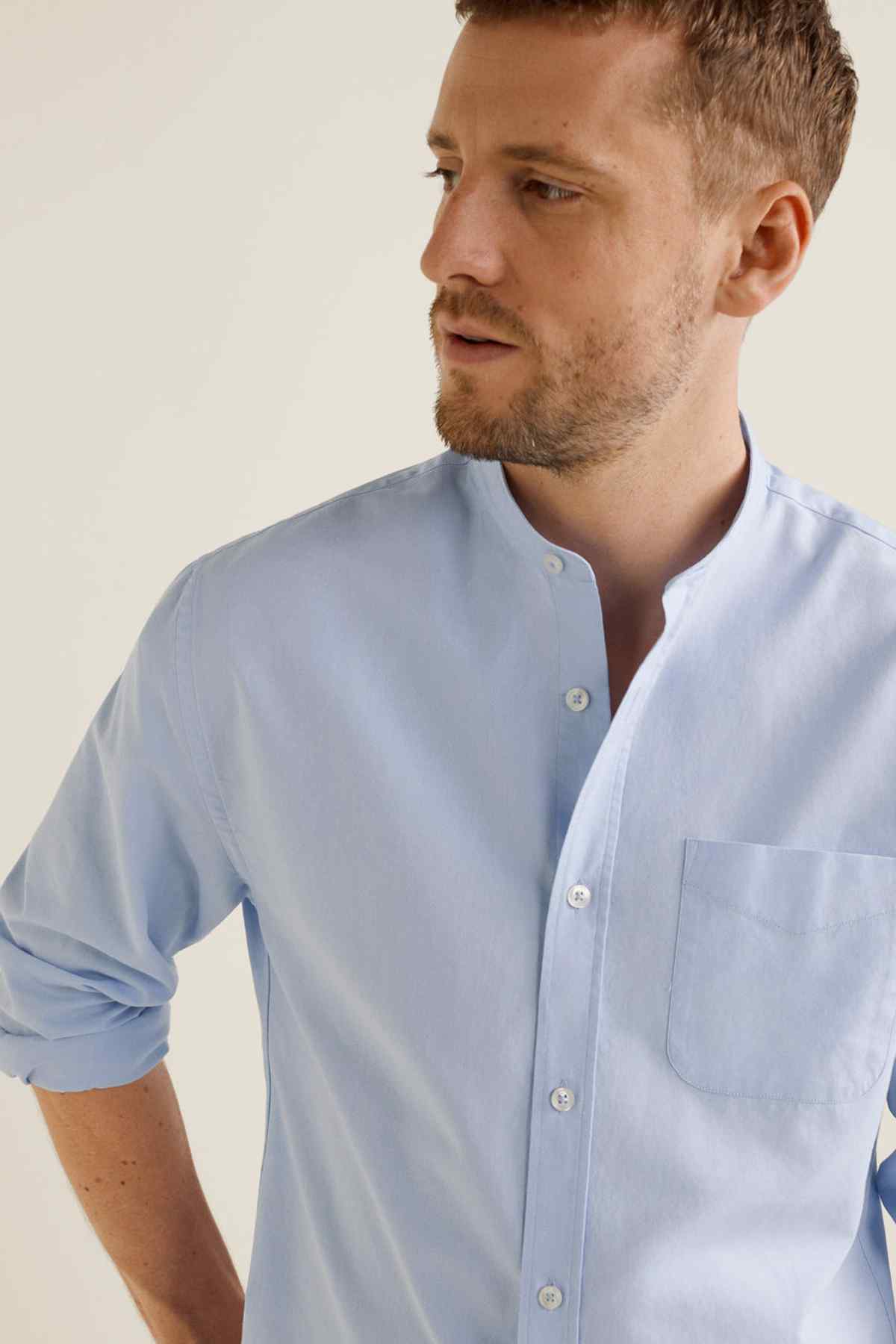 Sky blue button-up shirt close-up with button placket and chest pocket