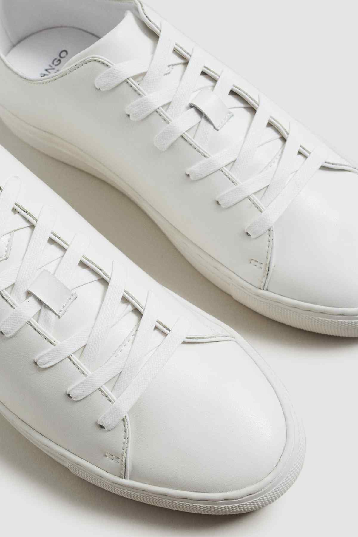 MANGO off-white lace-up sneakers close-up with white eyelets and stitching