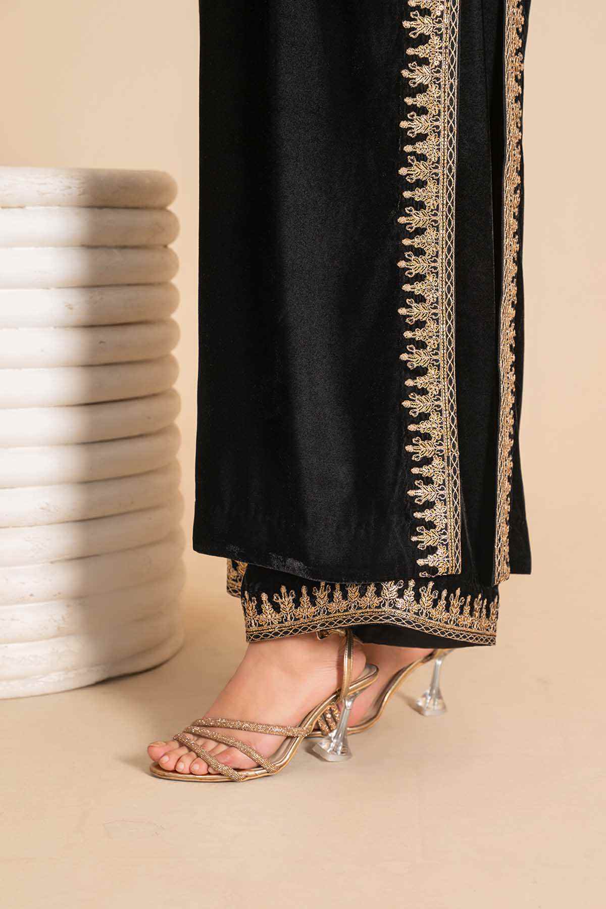 Black long tunic dress with gold embroidered border along front and hem