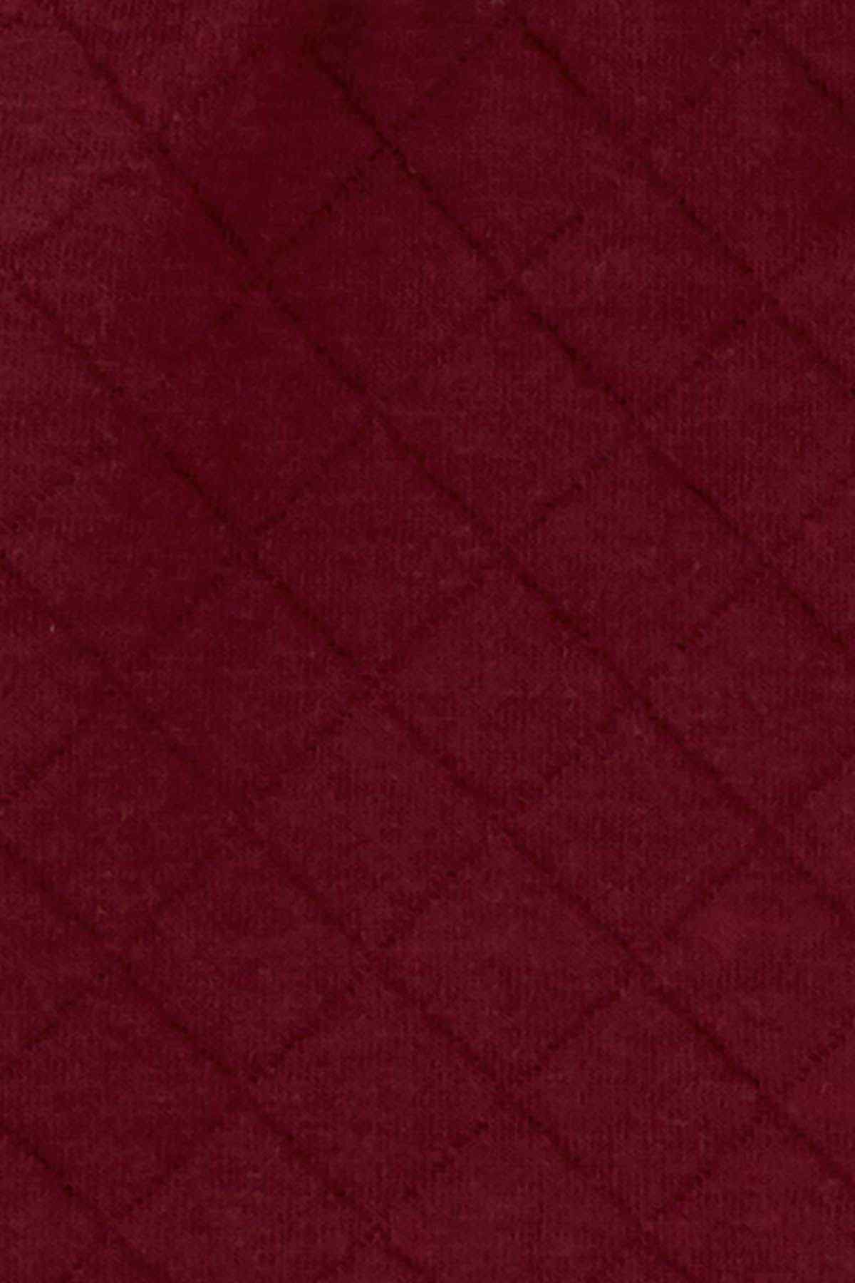 Maroon diamond-quilted fabric texture swatch