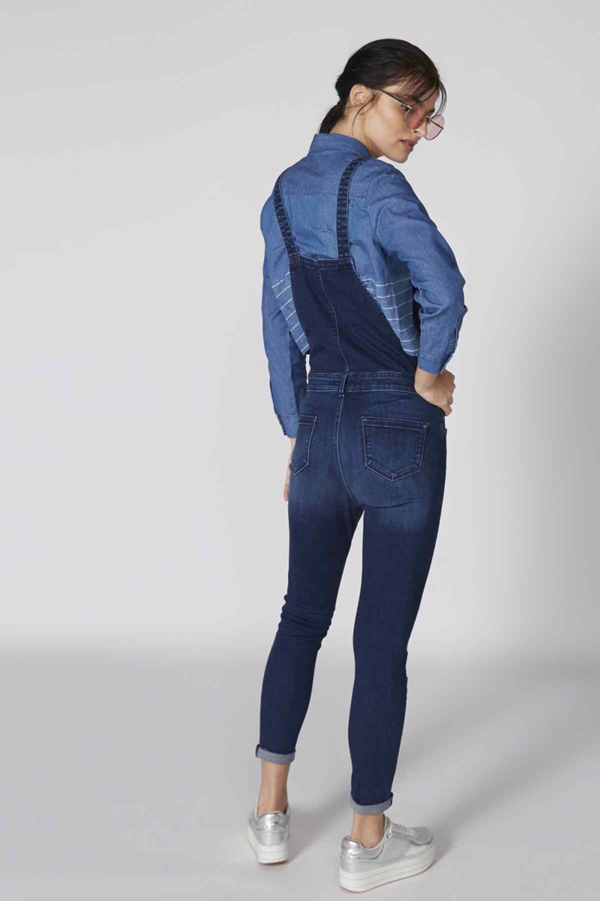 Blue denim overalls, long sleeves with back yoke, adjustable straps, tapered legs