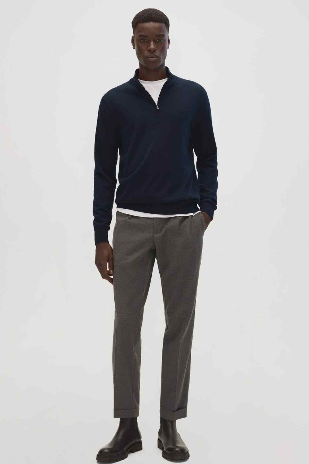 Men's navy quarter-zip sweater front view with stand collar