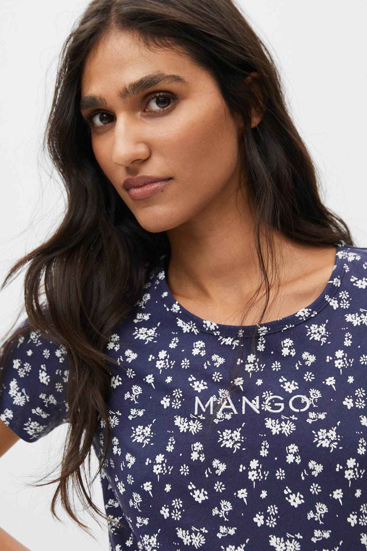 Navy floral T-shirt close-up with crew neck and MANGO chest logo