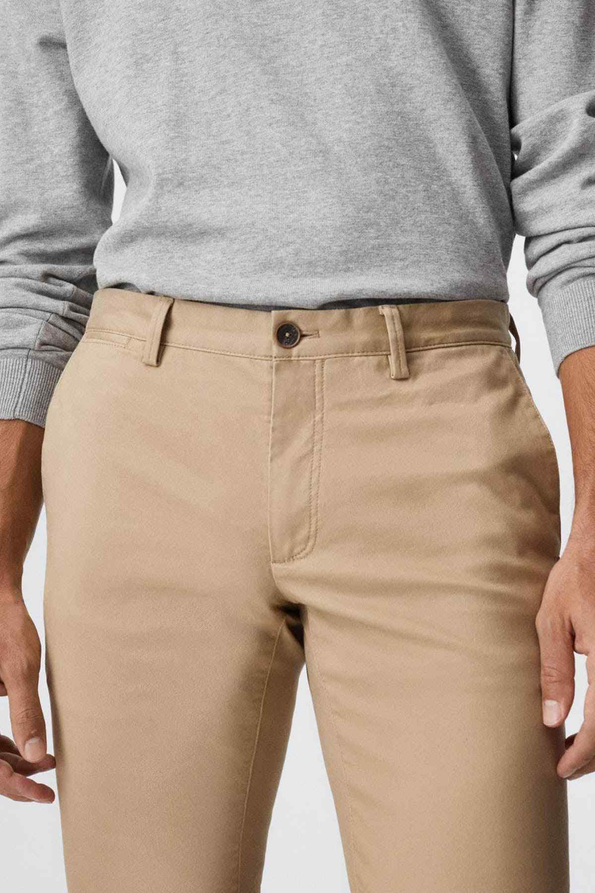 MANGO beige trousers front view with belt loops and button closure
