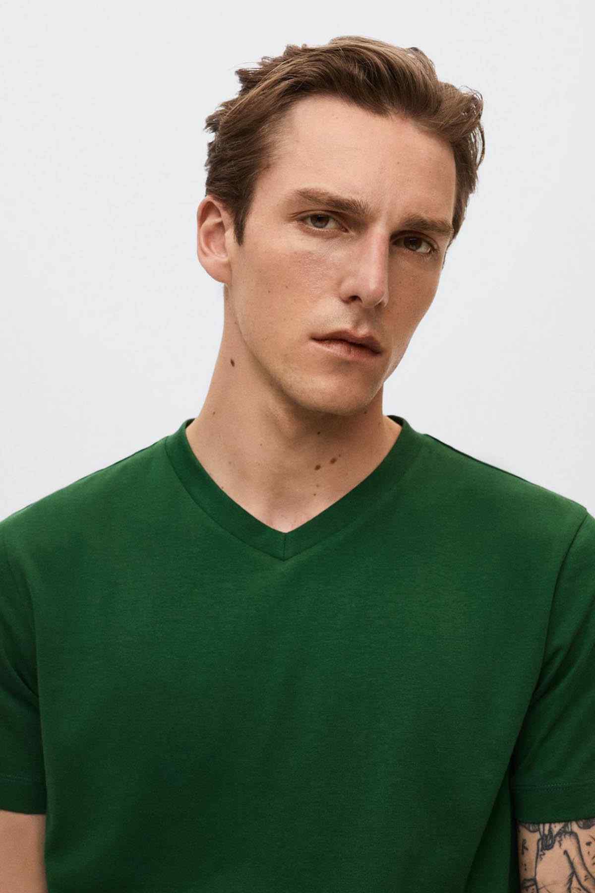 Green v-neck T-shirt close-up of neckline and short sleeves