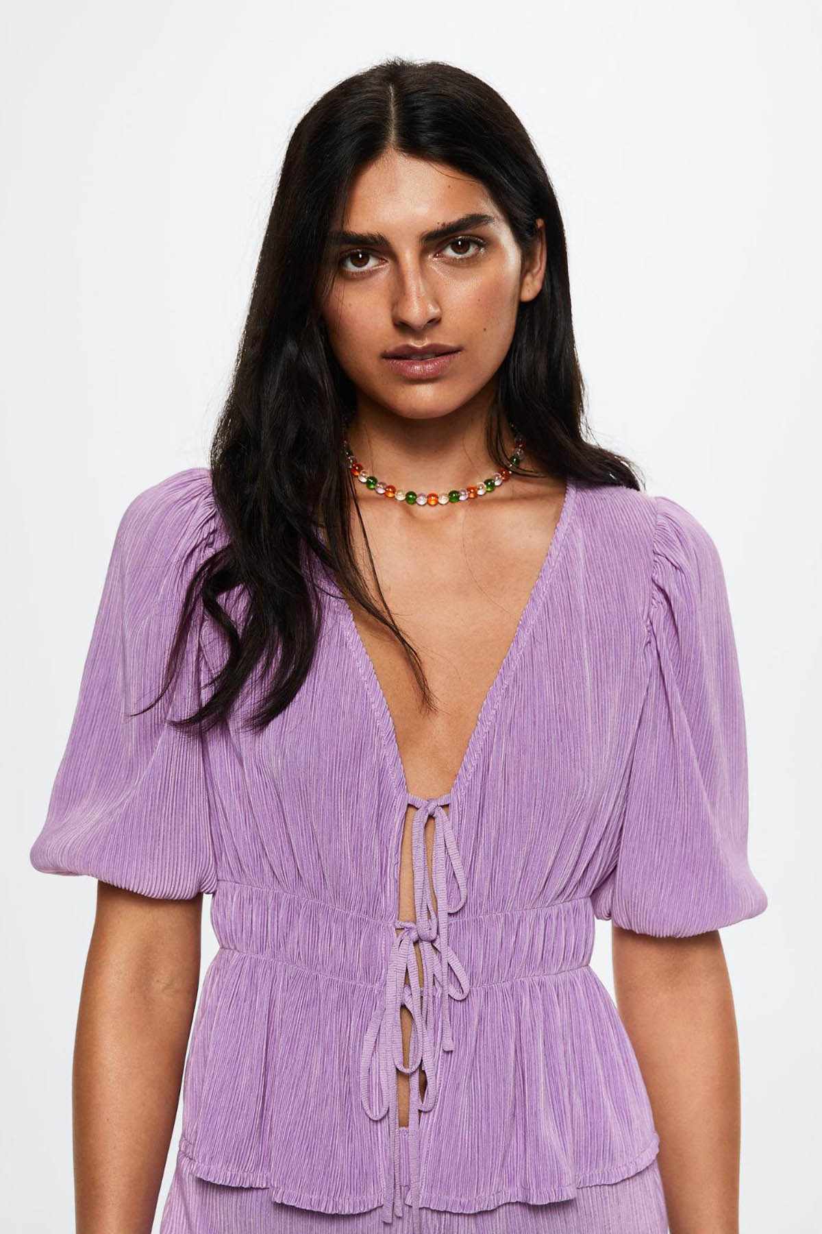 Light purple peplum blouse with V-neck, puff sleeves, and front drawstring tie