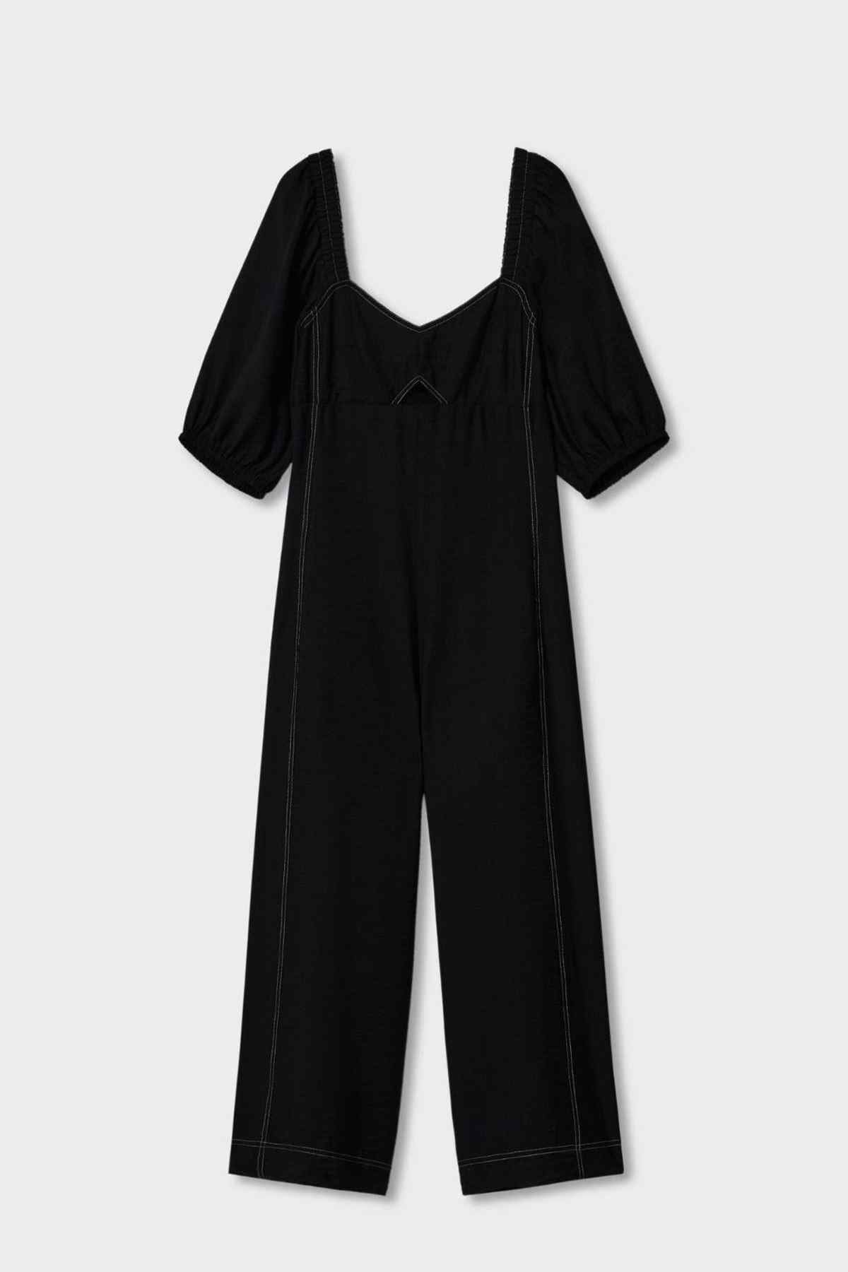 Black jumpsuit laid flat: puff sleeves, smocked bodice, wide-leg cropped fit