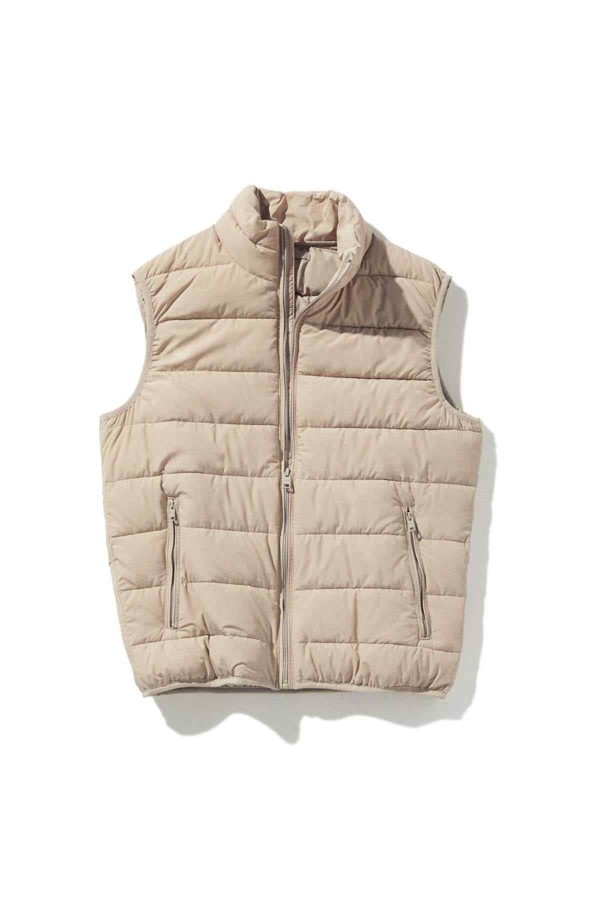Ice grey puffer vest flat lay with stand collar and zip front