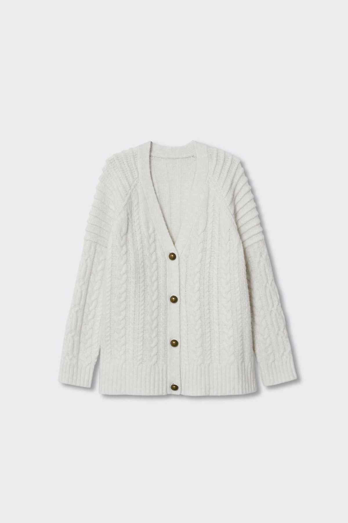 Ecru cable-knit cardigan laid flat, button-front and long sleeves