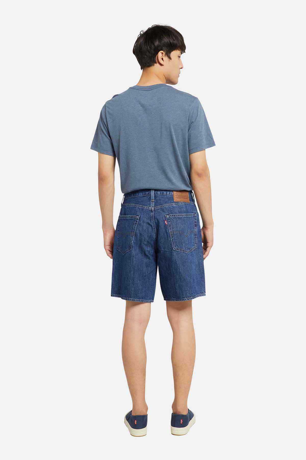 Blue denim shorts from back view, mid-thigh length, belt loops and stitched pockets