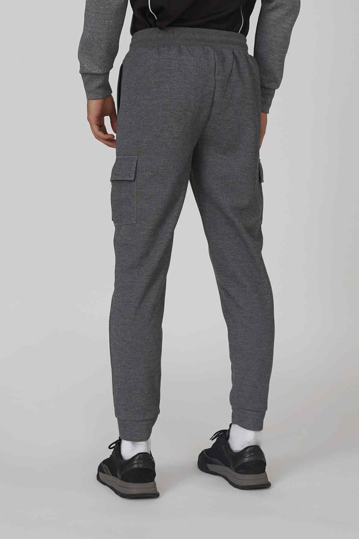 Grey back-view jogger pants with side cargo pocket and ankle cuffs