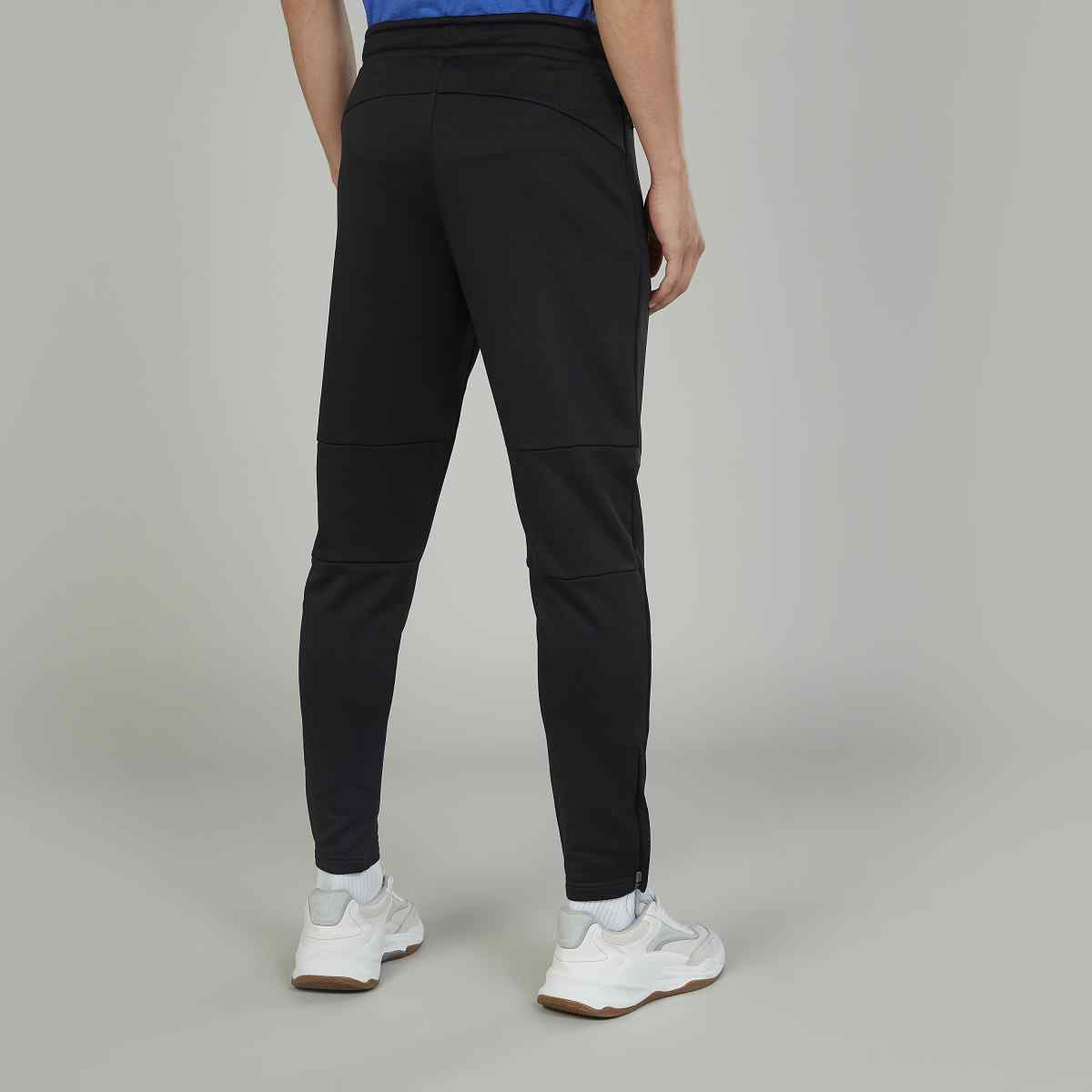 Black jogger pants back view with seam lines and tapered ankle cuffs