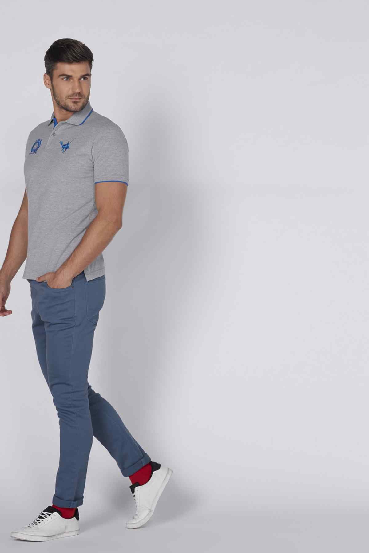Blue jogger pants on model, slim fit with drawstring waist