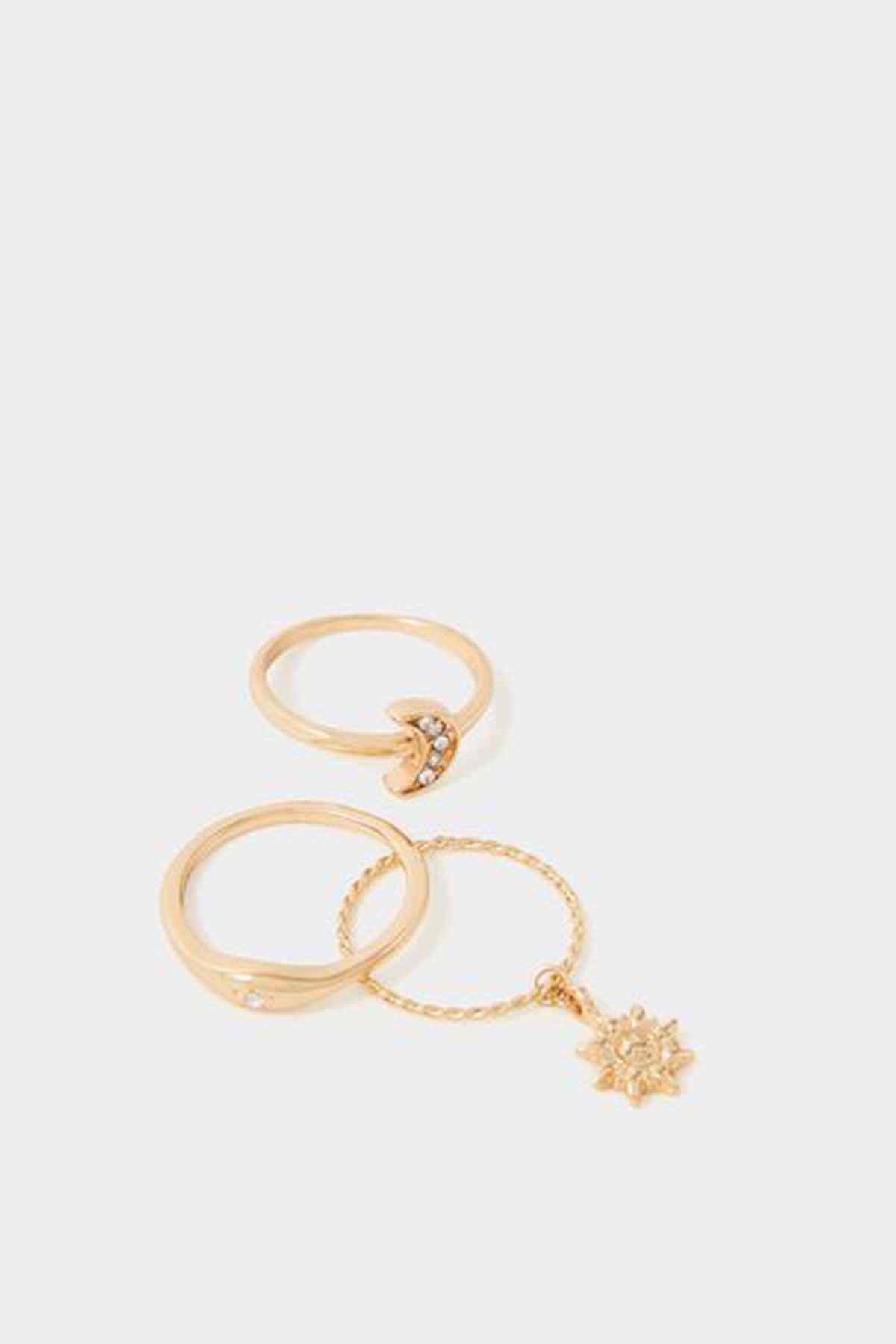 Gold-tone ring set with three bands and dangling starburst charm chain