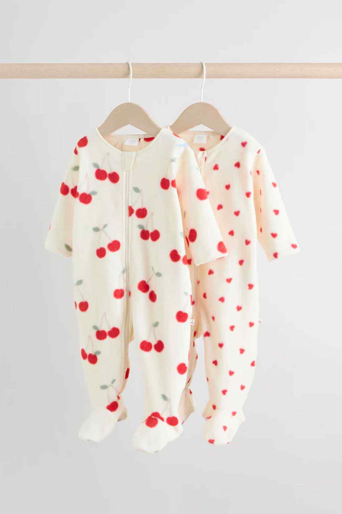 NEXT baby onesie, cream with red cherry print, long sleeves and footed legs