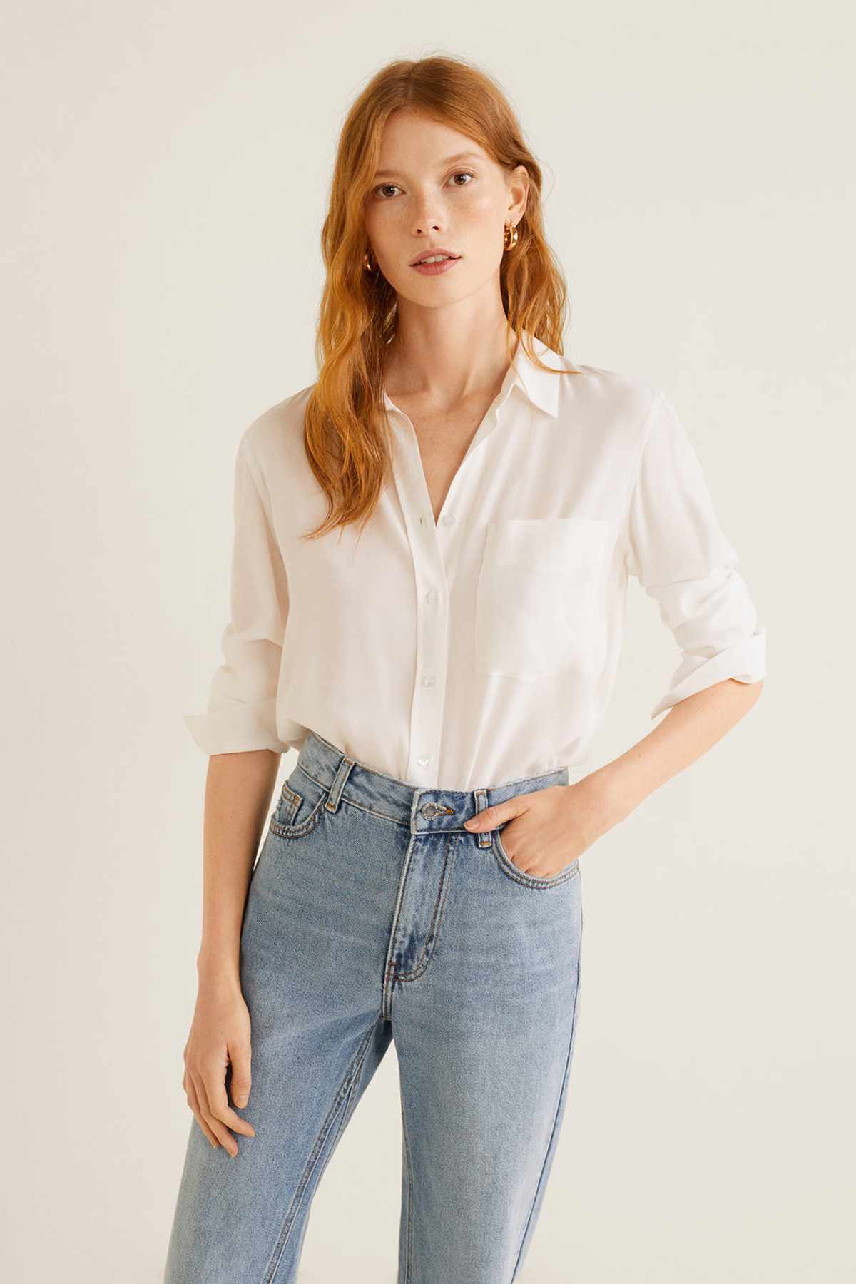 Light blue denim jeans with high-rise waist, belt loops, and front pockets