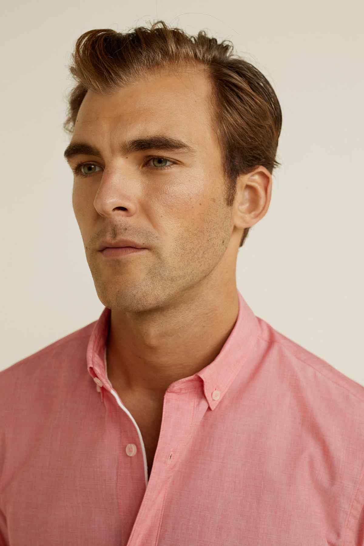 MANGO men's pink button-up shirt close-up with button-down collar and placket
