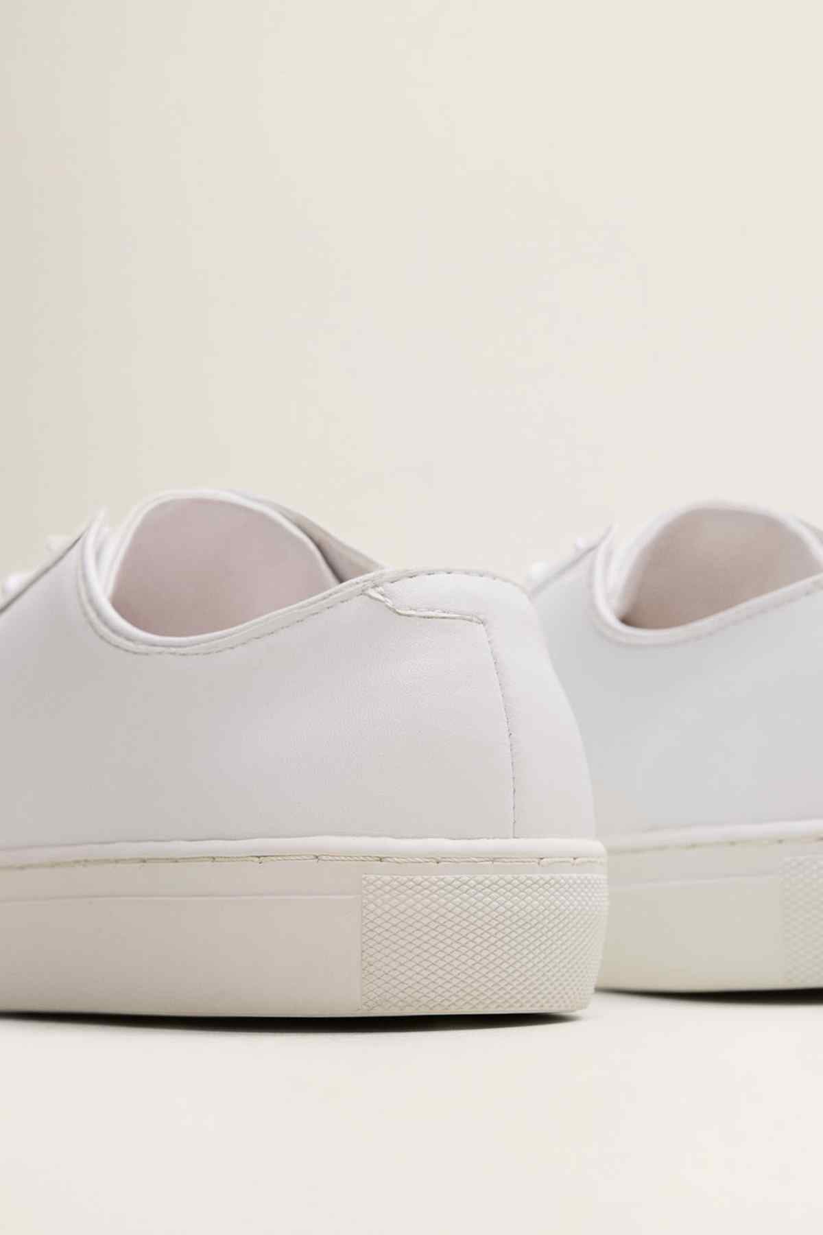 MANGO off-white sneakers, heel and back view with rubber sole