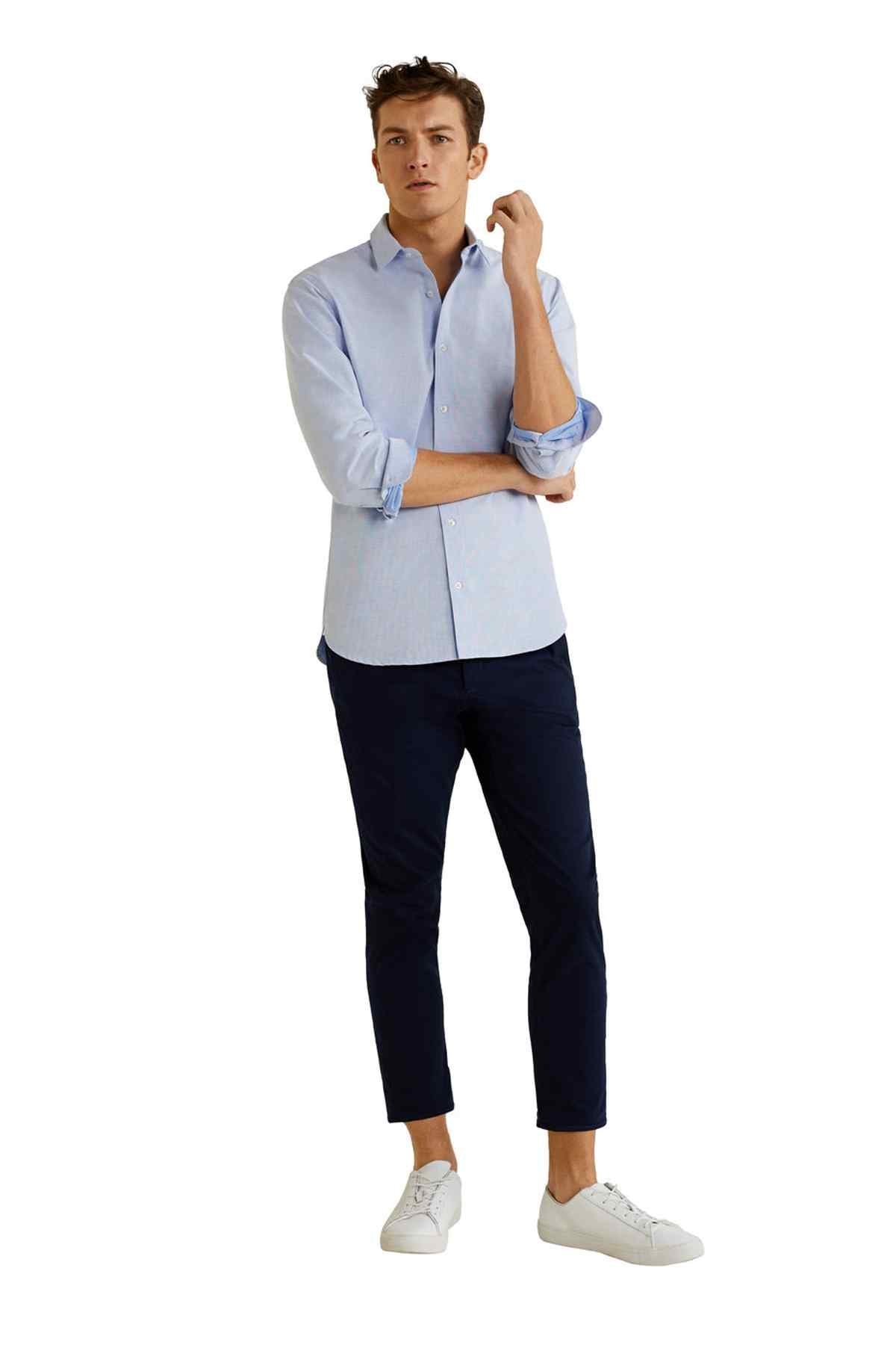 Men's sky-blue button-up shirt, standing pose, long sleeves and button placket