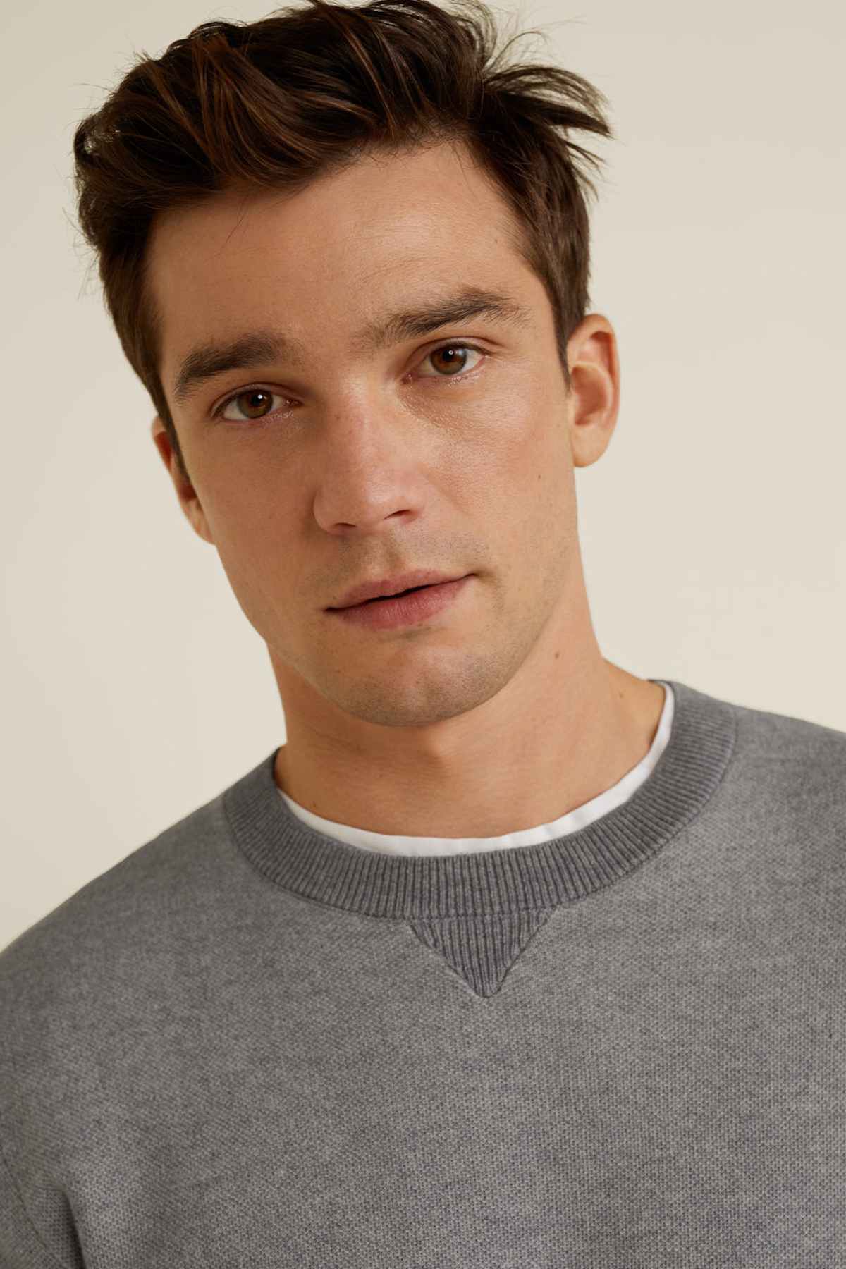 Heather grey crewneck sweatshirt close-up at neckline