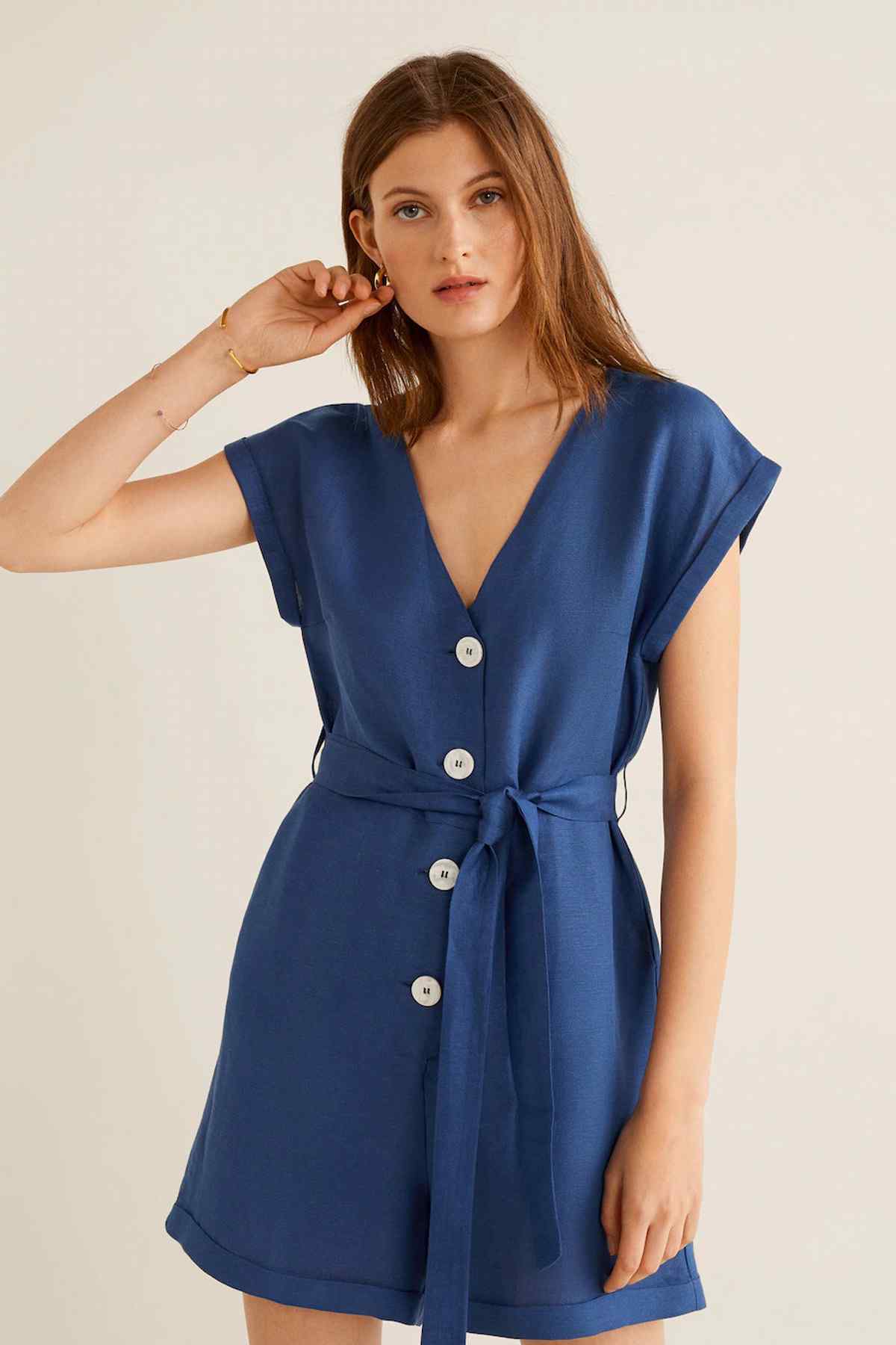 Blue belted button-front romper with V-neck, short sleeves, front buttons and tie waist