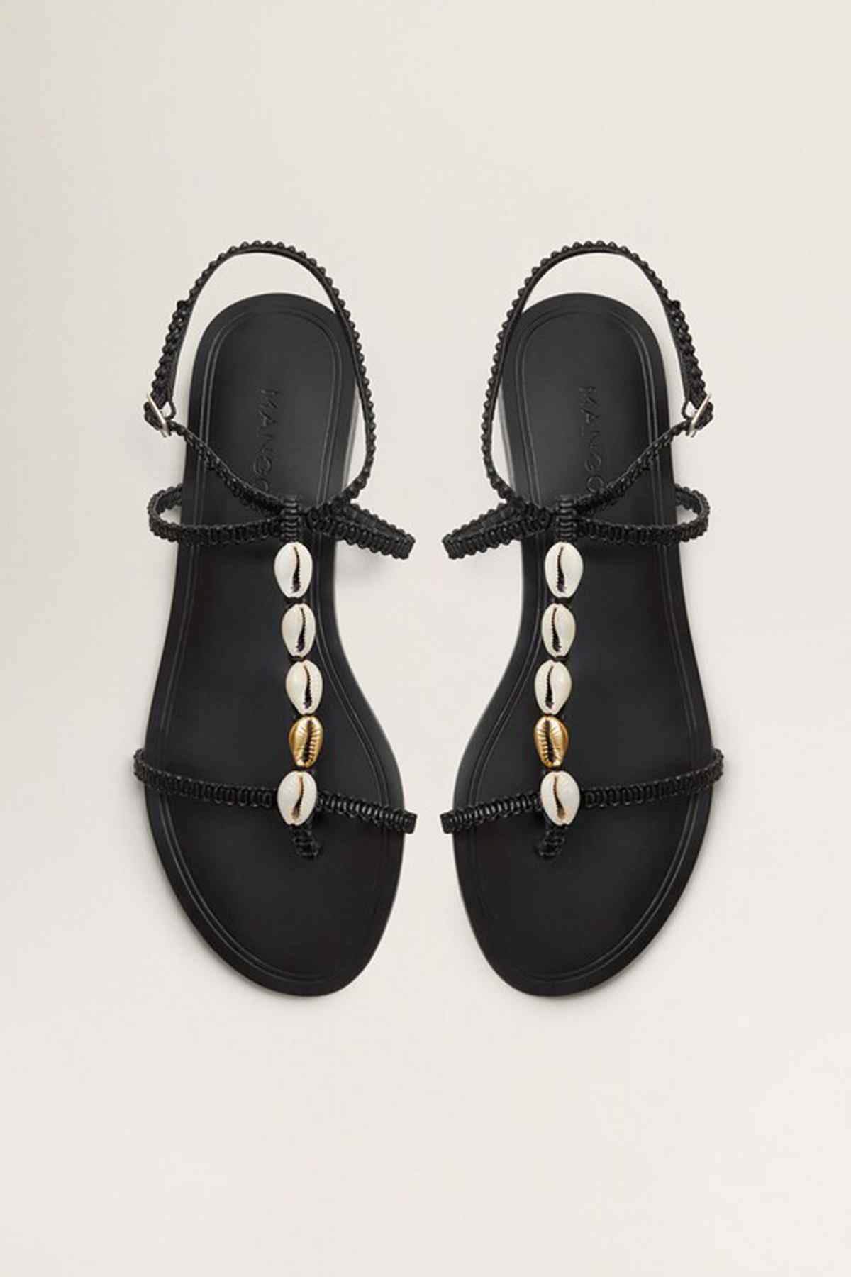Black thong sandals with shell bead fringe on straps and gold-toned accents