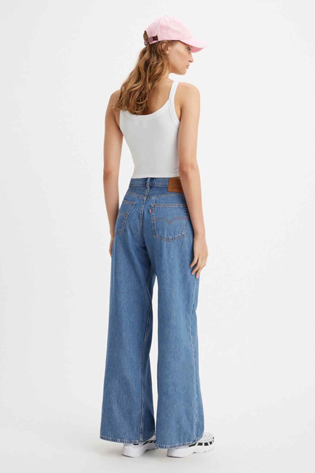 Medium indigo wide-leg jeans with worn-in wash and roomy straight legs