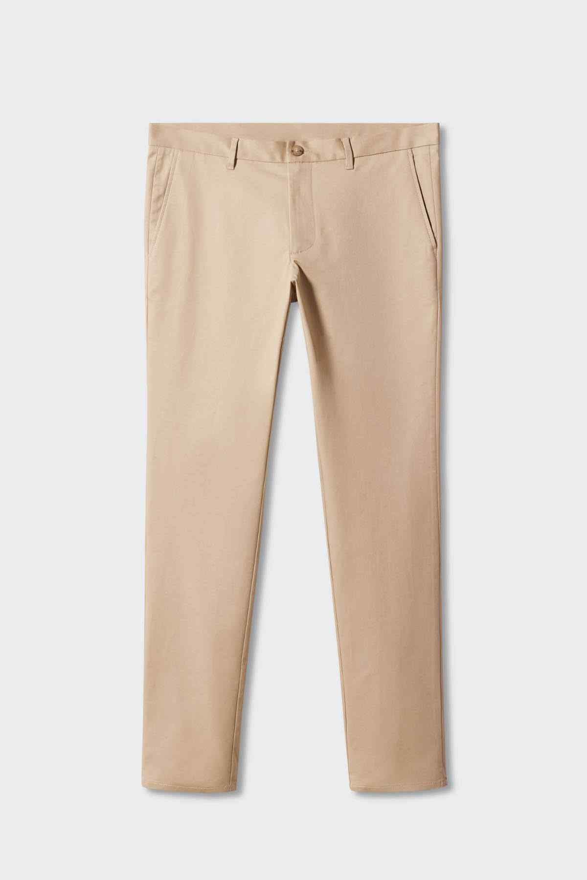 Beige chino pants on hanger, straight legs with belt loops and button closure