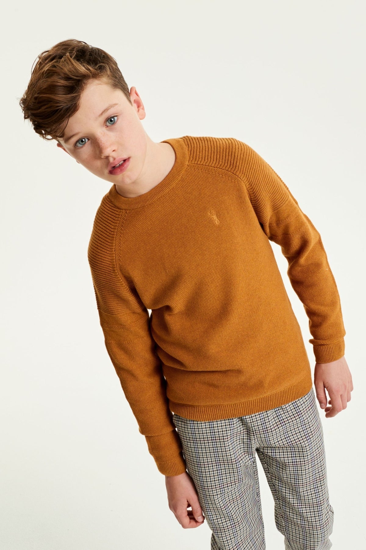 Mustard knit sweater with ribbed crew neckline and cuffs