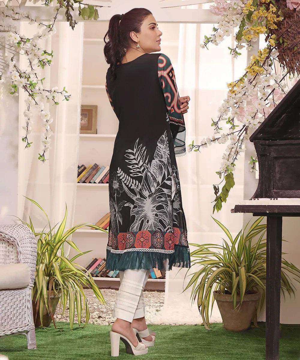 Black printed long tunic with white cutout neckline, multicolor sleeves, teal hem trim