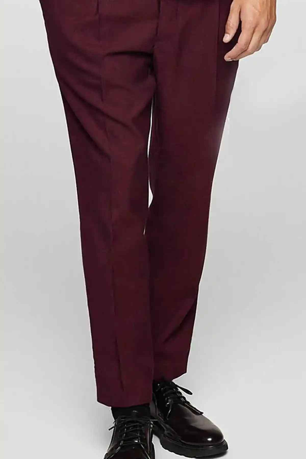 Maroon trousers with straight legs and front crease, side pockets