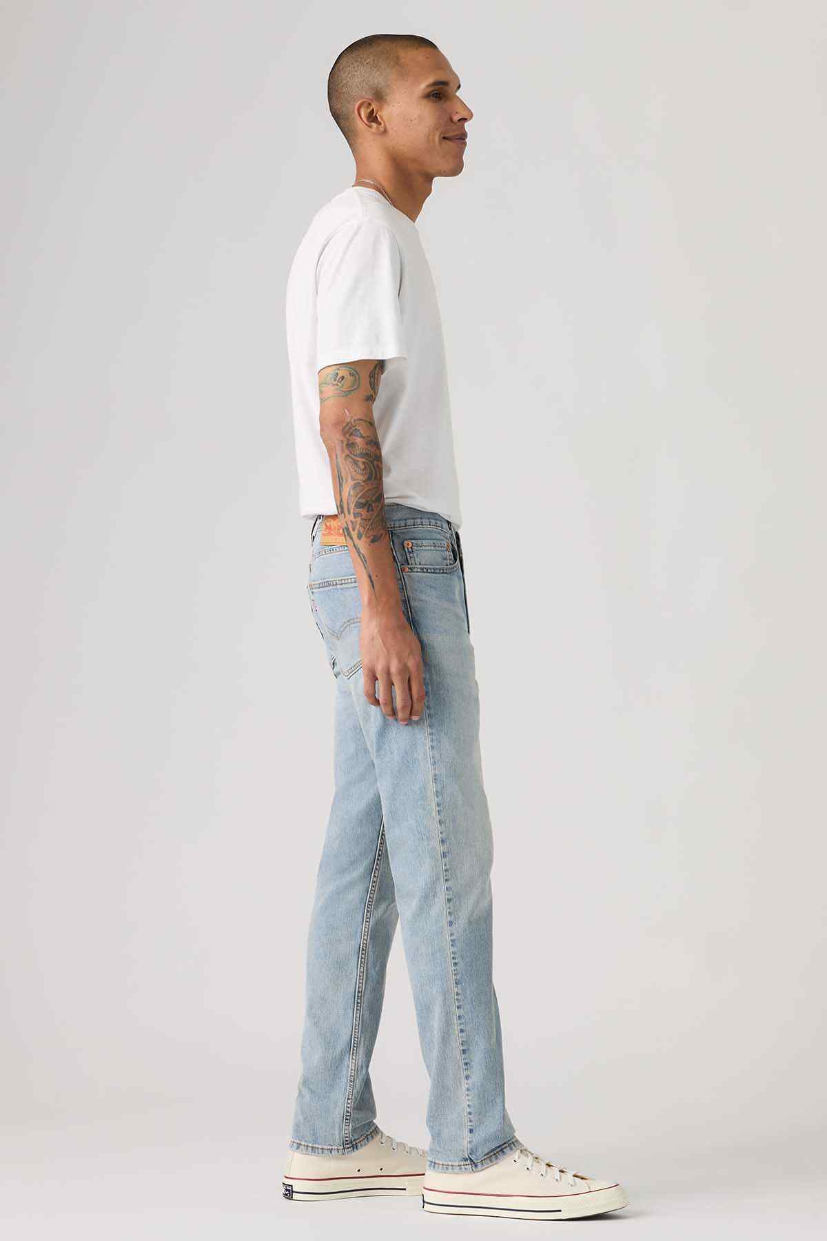 Levi's light-wash denim jeans side view with straight leg stitching