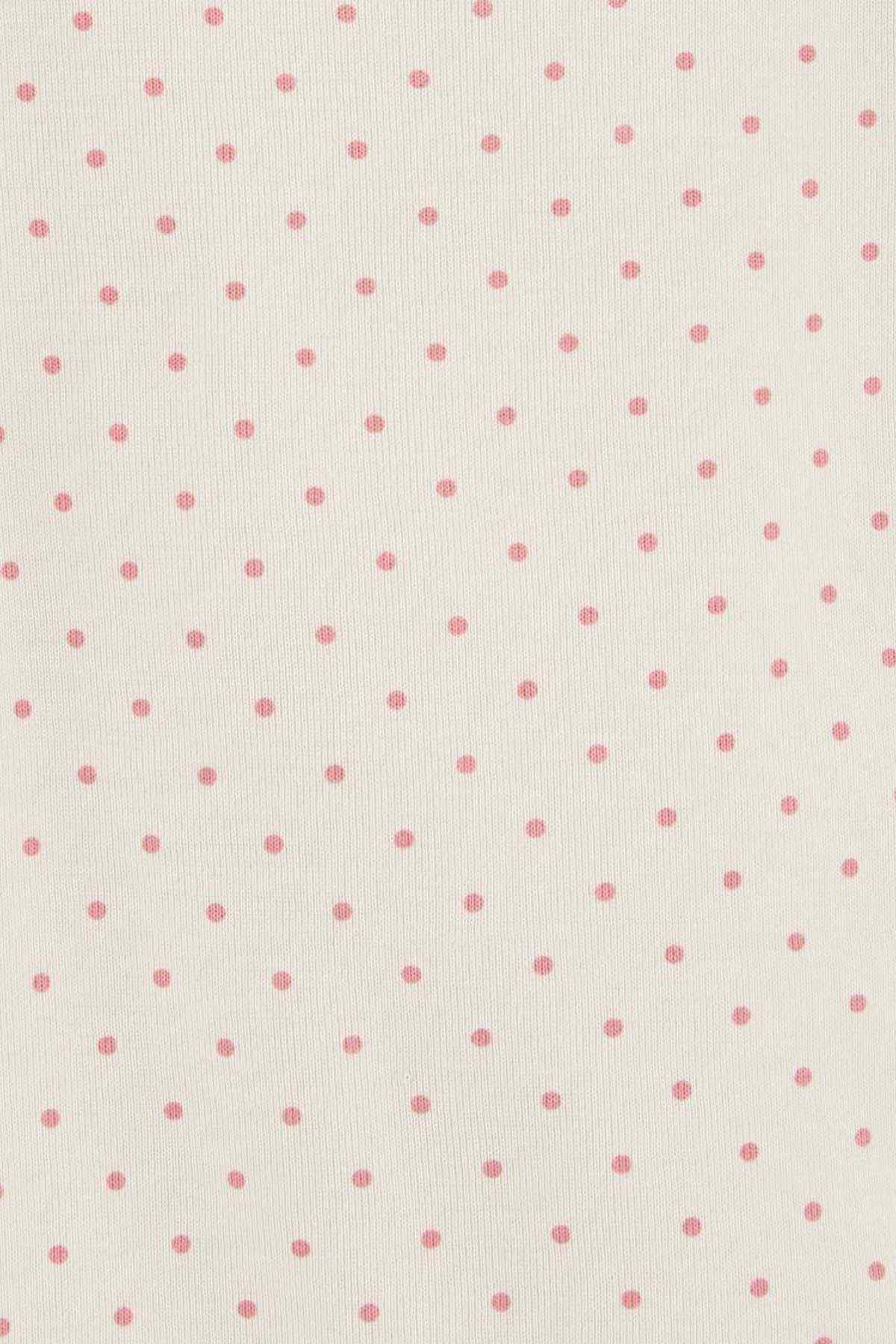 White fabric with small pink dot pattern