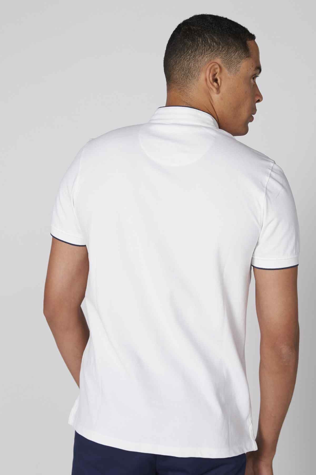 White polo shirt back view with short sleeves and navy-edged collar