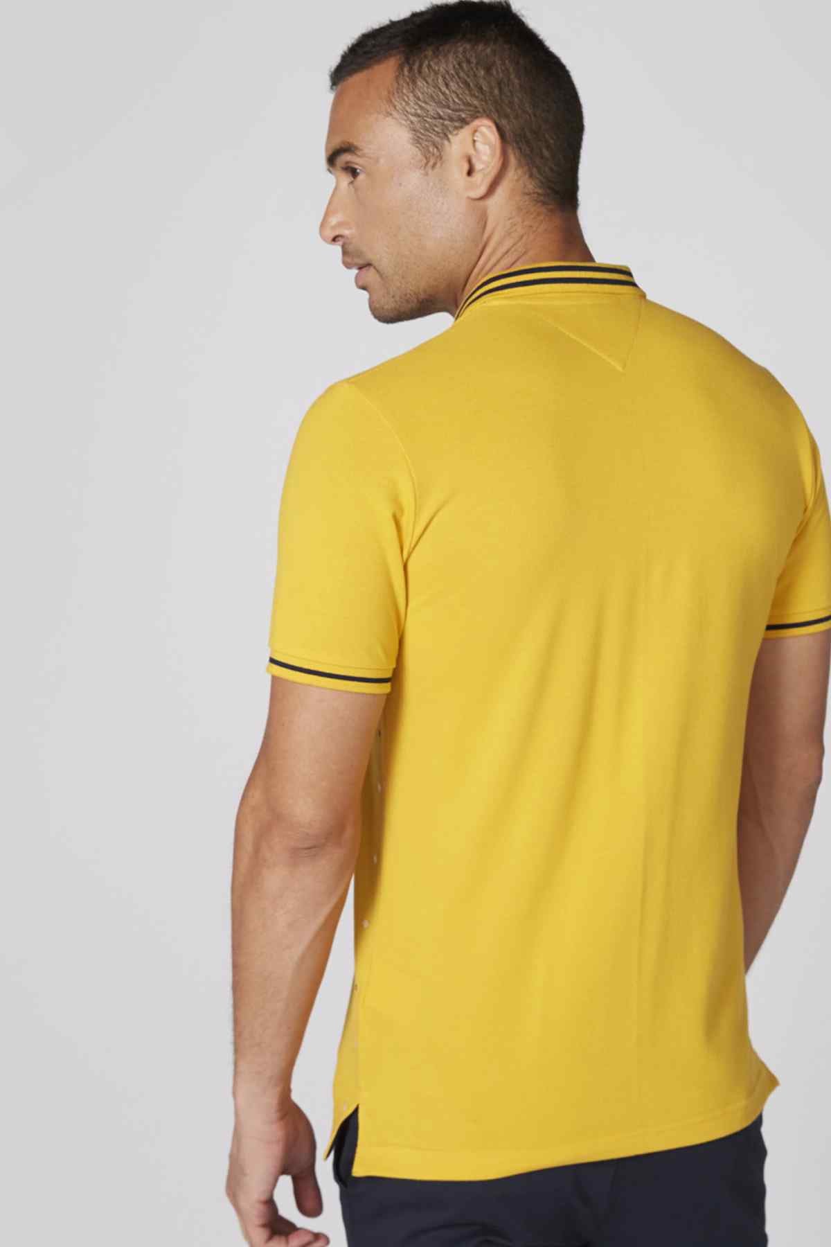Men's yellow polo shirt, back view, striped collar trim and short sleeves