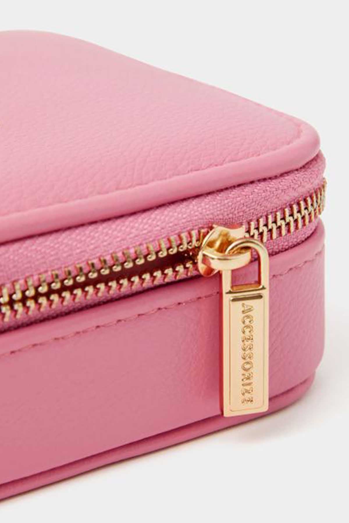 Pink mini pouch with gold zipper pull and zipper detail