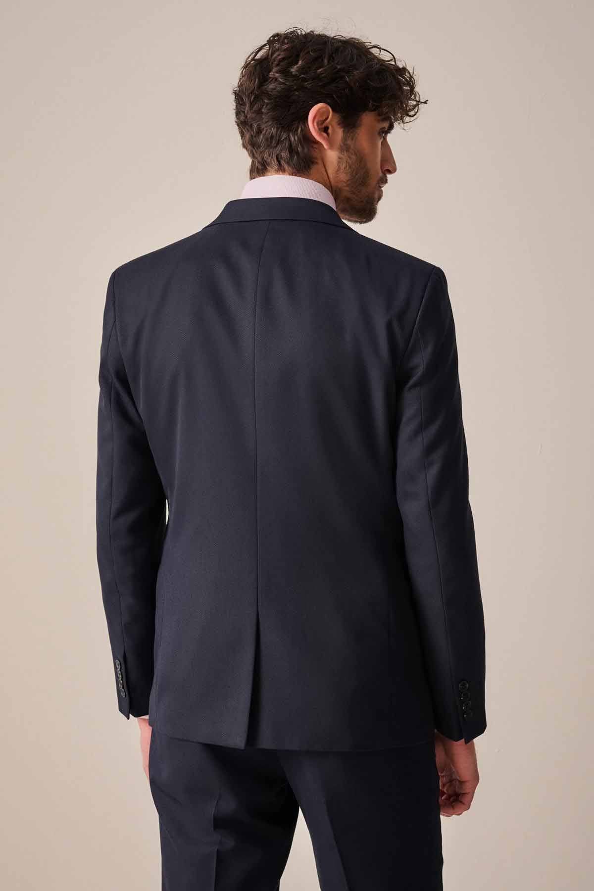 Men's navy suit jacket back view with center vent